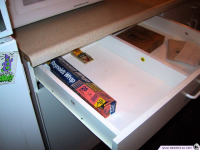 The drawer where Tim Schafer lost his parmesan cheese, now featuring a rat trap.
