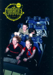 The Mojo staff on a ride in Disney World. Spaff is so devoted to Mojo that he attempts to update the site on a hidden laptop.